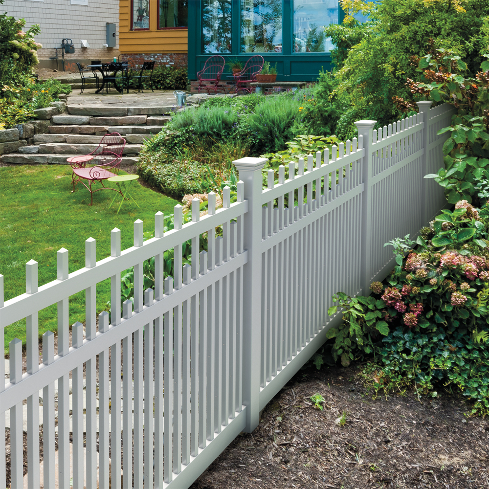 Photo of a white picket vinyl fence in a front yard